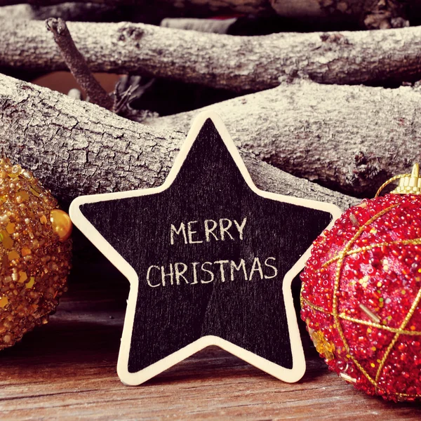 Texto Feliz Navidad en una pizarra en forma de estrella — Foto de Stock