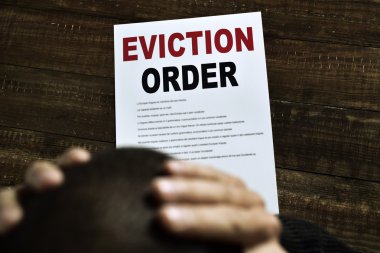 young man who has received an eviction order clipart