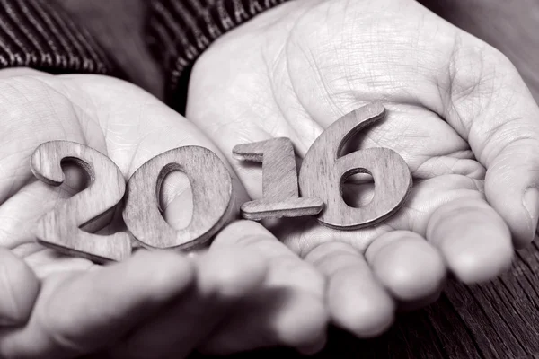 2016, as the new year, in the hands of a man, duotone — Stock Photo, Image