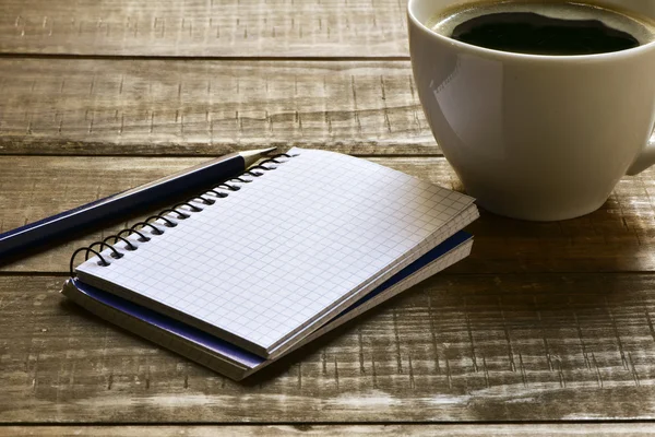 Blank notebook, pen and cup of coffee — Stock Photo, Image