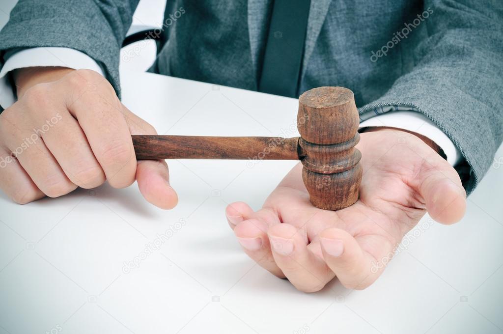 man with a gavel in his hand