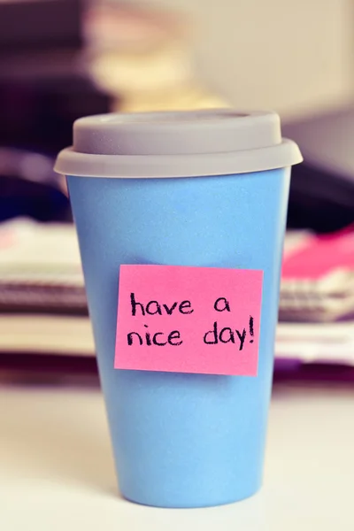 Text have a nice day in a cup of coffee or tea — Stock Photo, Image