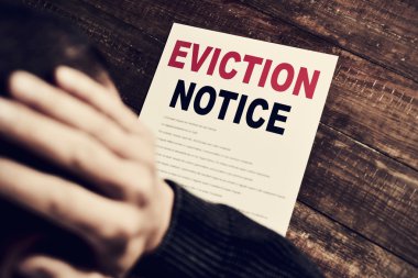 young man who has received an eviction notice clipart