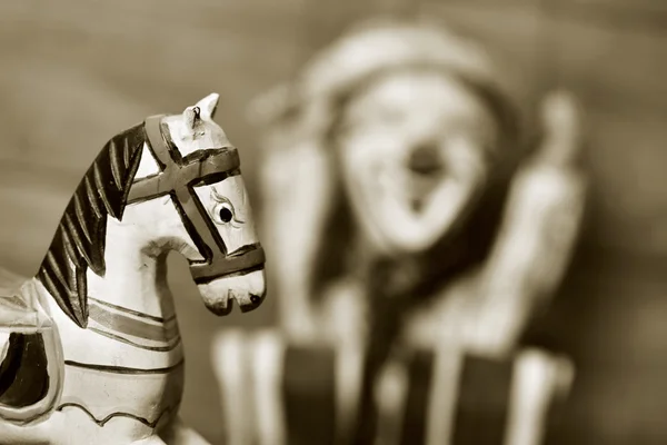 Old wooden horse and old marionette, in sepia toning — Stock Photo, Image