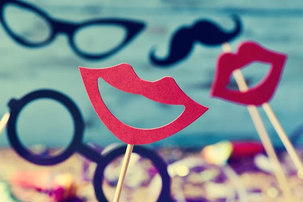 Mouths, eyeglasses and mustaches on sticks — Stock Photo, Image