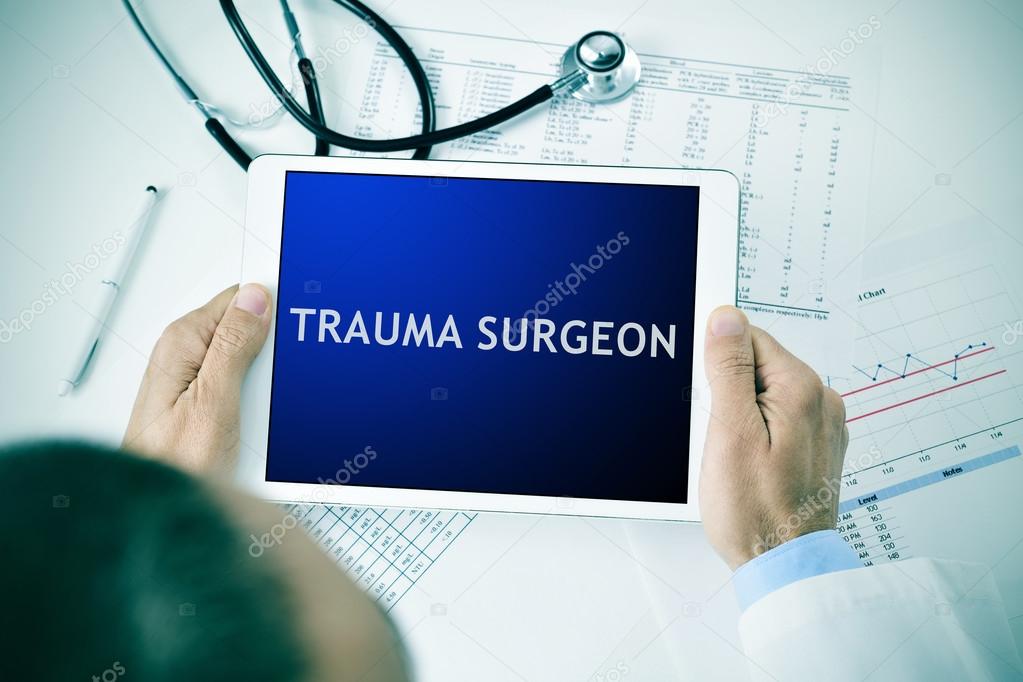 doctor with a tablet with the text trauma surgeon