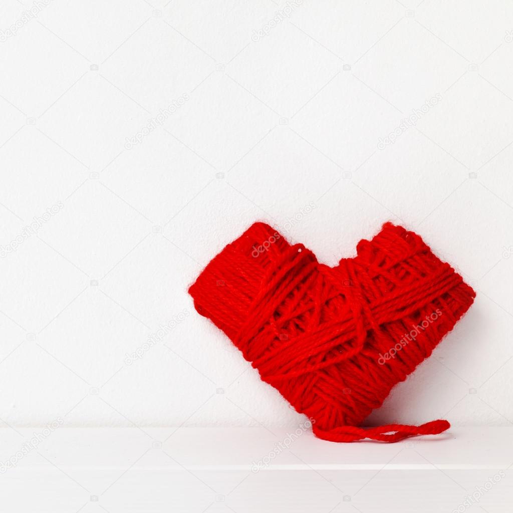 heart-shaped coil of red yarn