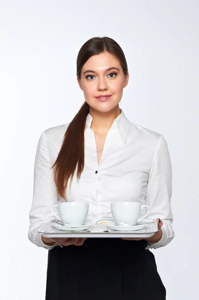 Young woman brings coffee — Stock Photo, Image