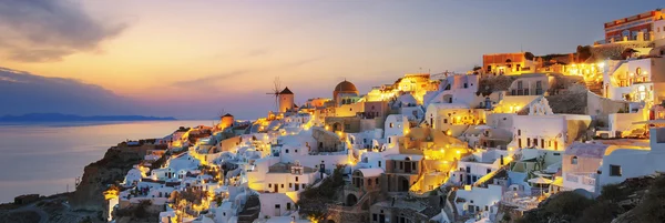 Panoramic view of Oia at sunset — Stock Photo, Image