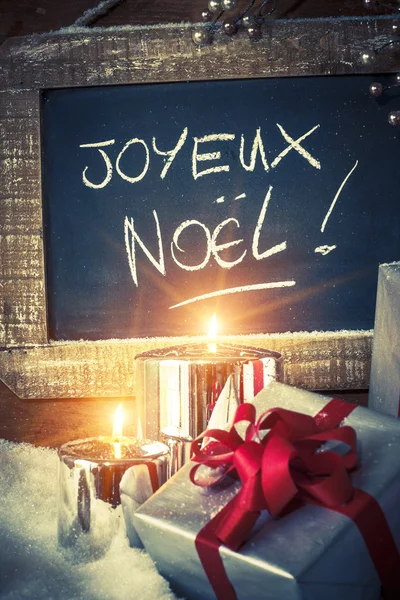 Closeup of Christmas gifts with candles — Stock Photo, Image