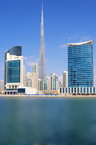 Vertical view of Dubai skyline with blue sky — Stock Photo, Image