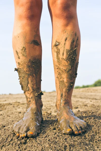 dirty feet.Bare feet are on the ground