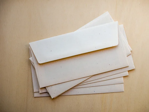 Letter envelope on wood table — Stock Photo, Image