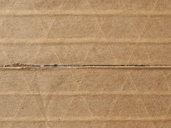 Коричневый гофрированный картон фон — стоковое фото