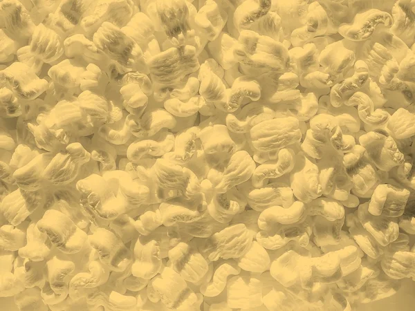 White polystyrene beads background sepia — Stock Photo, Image