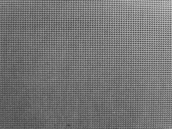 Grey plastic grid background in black and white — ストック写真