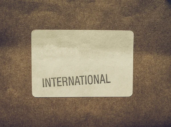 Vintage buscando etiqueta internacional en el paquete — Foto de Stock