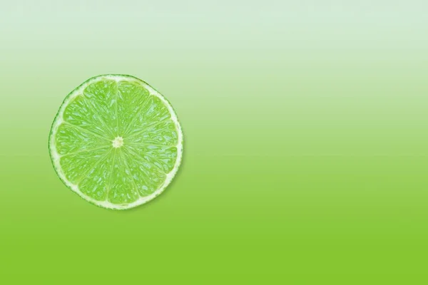 Green Lime Slice Matching Colour Gradient Background Copy Space — Stock Photo, Image