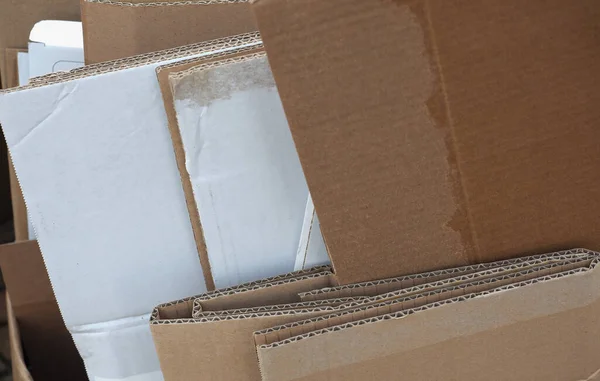 many cardboard boxes for shipping packets with post or courier