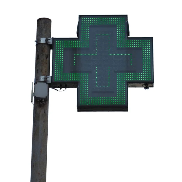 白い背景に隔離された緑の十字薬局の看板 — ストック写真
