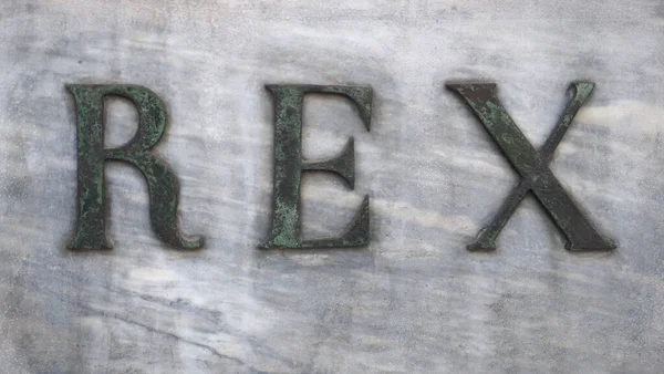 大理石にブロンズ文字で書かれたレックス — ストック写真