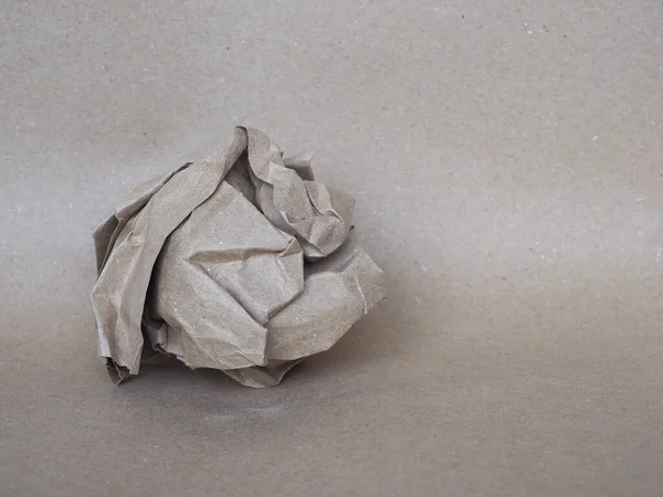 Crumpled Paper Ball Brown Paper Background — Stock Photo, Image