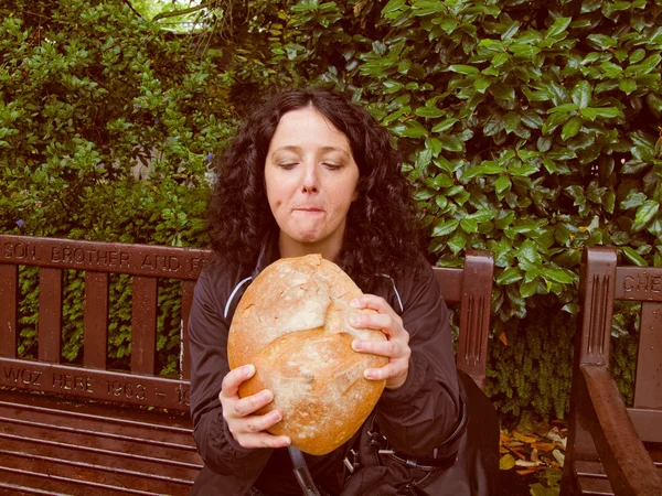 Girl eating bread — Stock Photo, Image