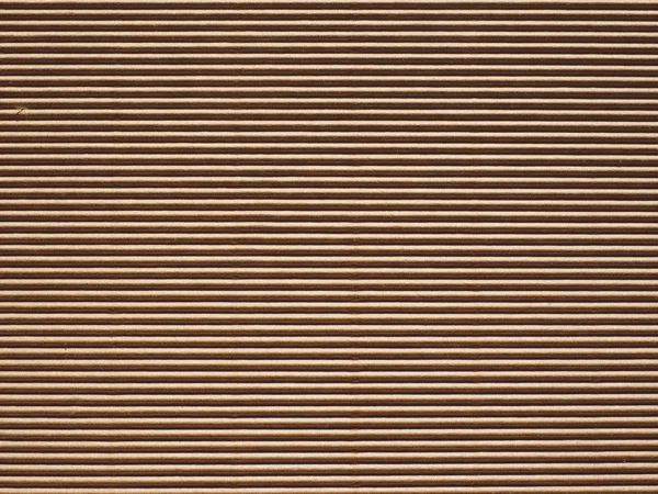 Sheets of corrugated cardboard stacked together.
