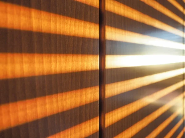 Sunlight through shutter — Stock Photo, Image