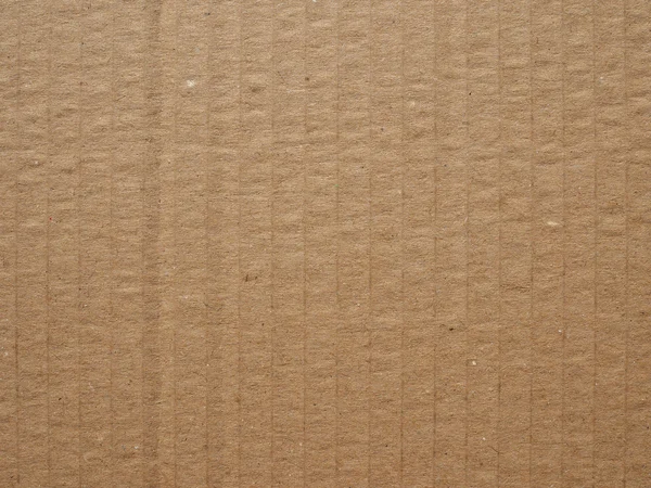 Коричневый гофрированный картон фон — стоковое фото