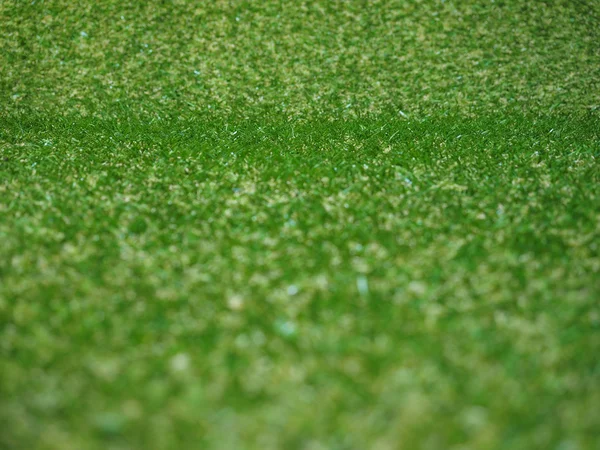 Зеленый искусственный синтетический луг — стоковое фото