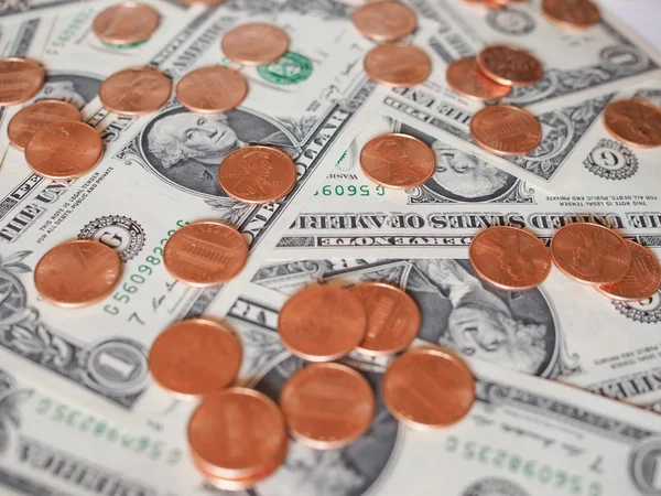 Monedas y billetes de dólar — Foto de Stock