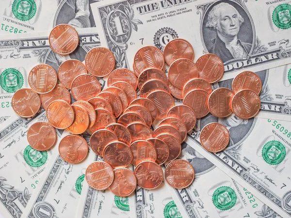 Moedas e notas em dólares — Fotografia de Stock