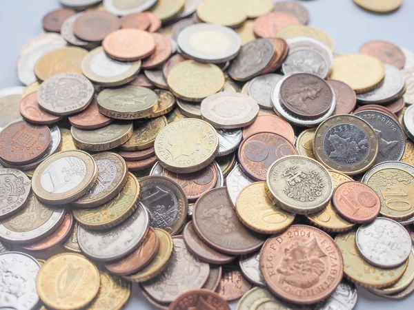 Euro and Pounds coins — Stock Photo, Image