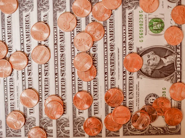 Retro olhar moedas de dólar e notas — Fotografia de Stock