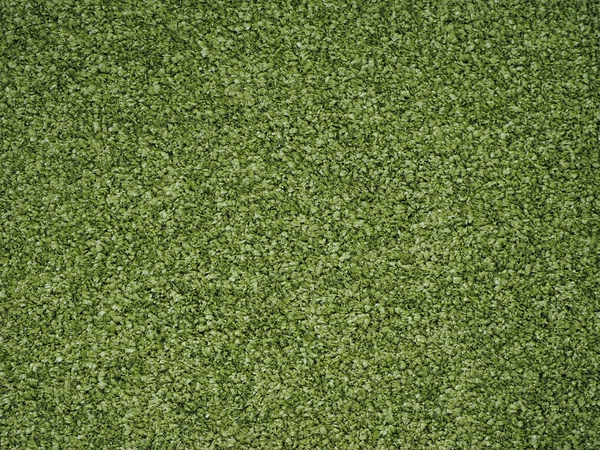 Зеленый искусственный синтетический луг — стоковое фото