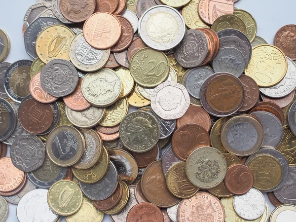 Euro and Pounds coins — Stock Photo, Image