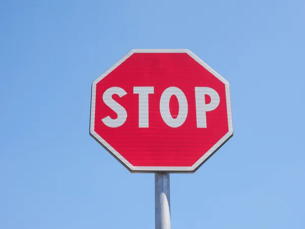 Stop sign over blue sky Stock Image