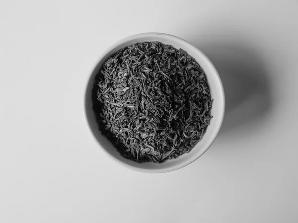 Schwarze und weiße lose Teeschale — Stockfoto