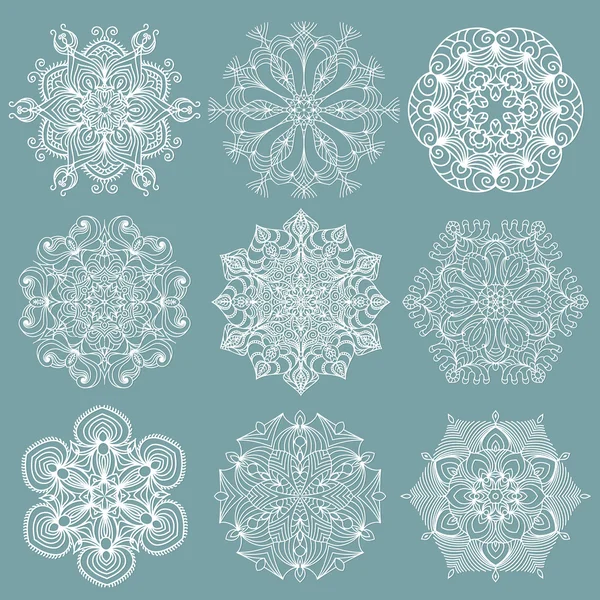 Flocons de neige ajourés — Image vectorielle