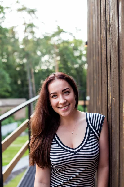 Happy girl looking at the camera. Striped T-shirt — Stock Photo, Image