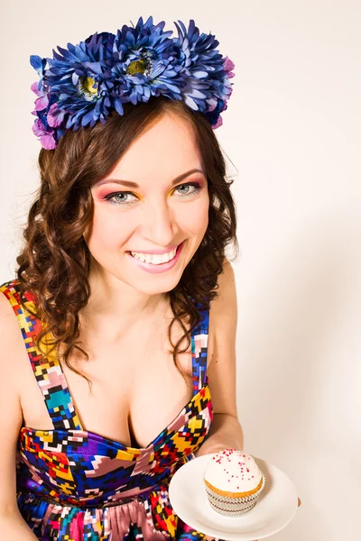 Attractive girl at a party with cupcakes — Stock Photo, Image