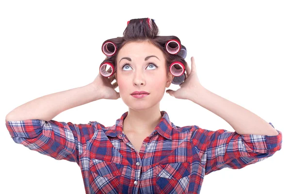 Funny beauty woman with hair rollers looking up — Stock Photo, Image