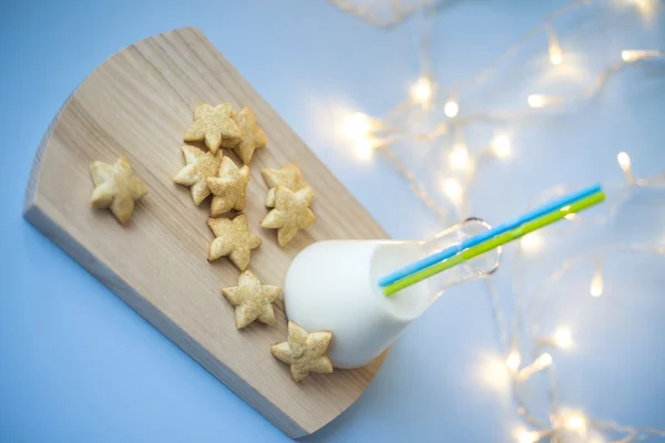 Beautiful composition with Christmas cookies and milk — Stock Photo, Image