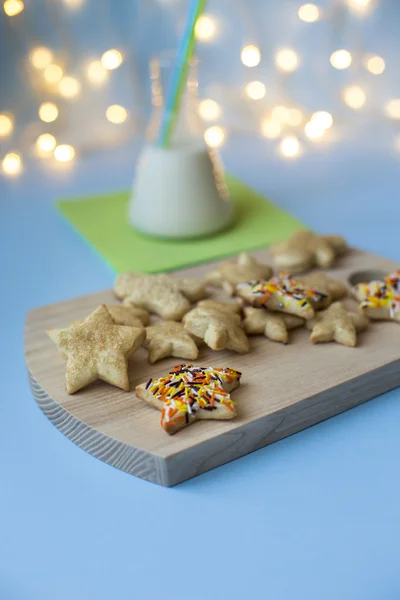 Sweet Christmas cookies with milk on wooden desks — Stock Photo, Image