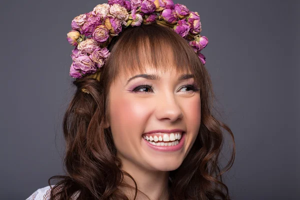 Sensual sexy beautiful curly girl with a floral wreath on her head — Stock Photo, Image