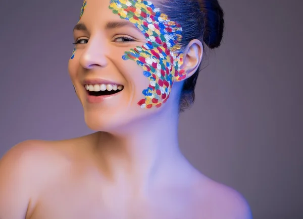 Attractive model in the studio. make up in multi-colored point — Stock Photo, Image