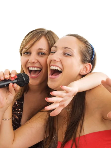 Meninas cantando karaoke — Fotografia de Stock