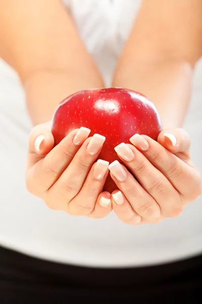 Young woman holding apple — Stock Photo, Image