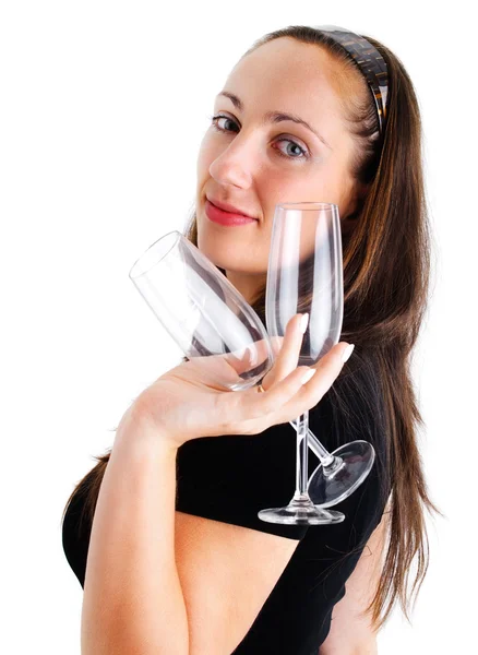 Молодая женщина с двумя флейтами шампанского — стоковое фото